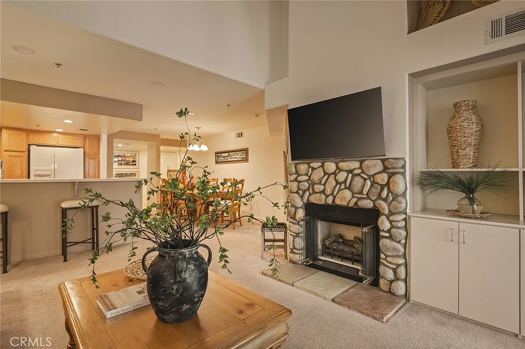 306 Villa Way — Living room with stone fireplace