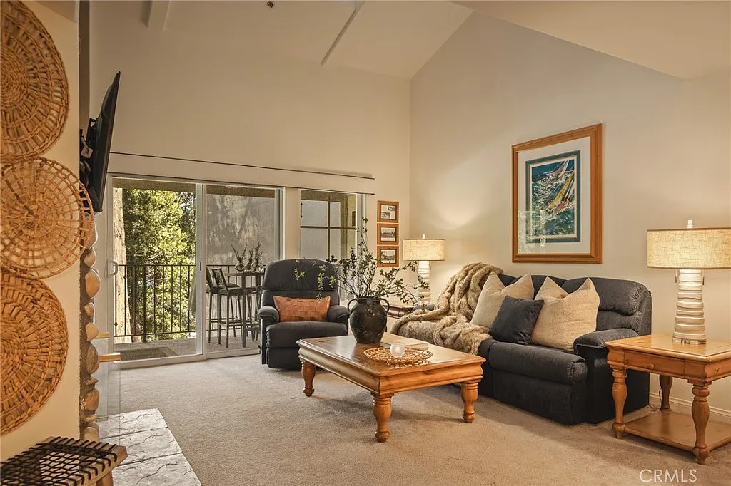 306 Villa Way — Living room opening to the balcony